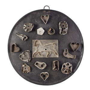 Antique Cookie Cutters, Collection of 16 Displayed on Wrought Iron Griddle Inventory Thumbnail